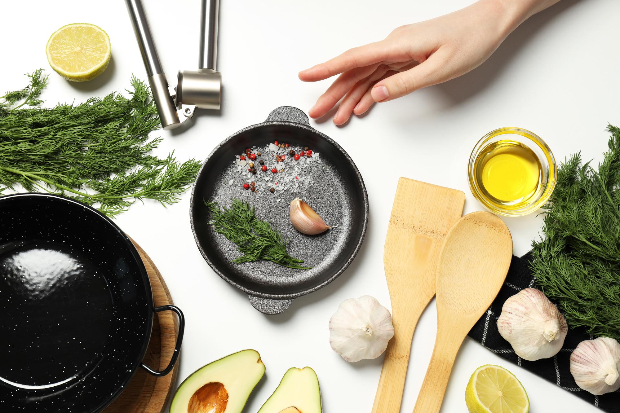 Close-up hands seasoning a pan